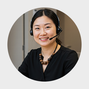 Knick customer service, showing a friendly person. The person is in the office. 